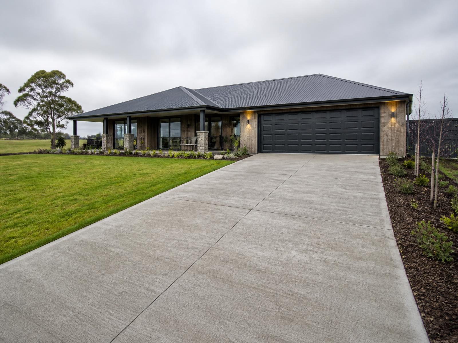 Concrete driveway to a double garage